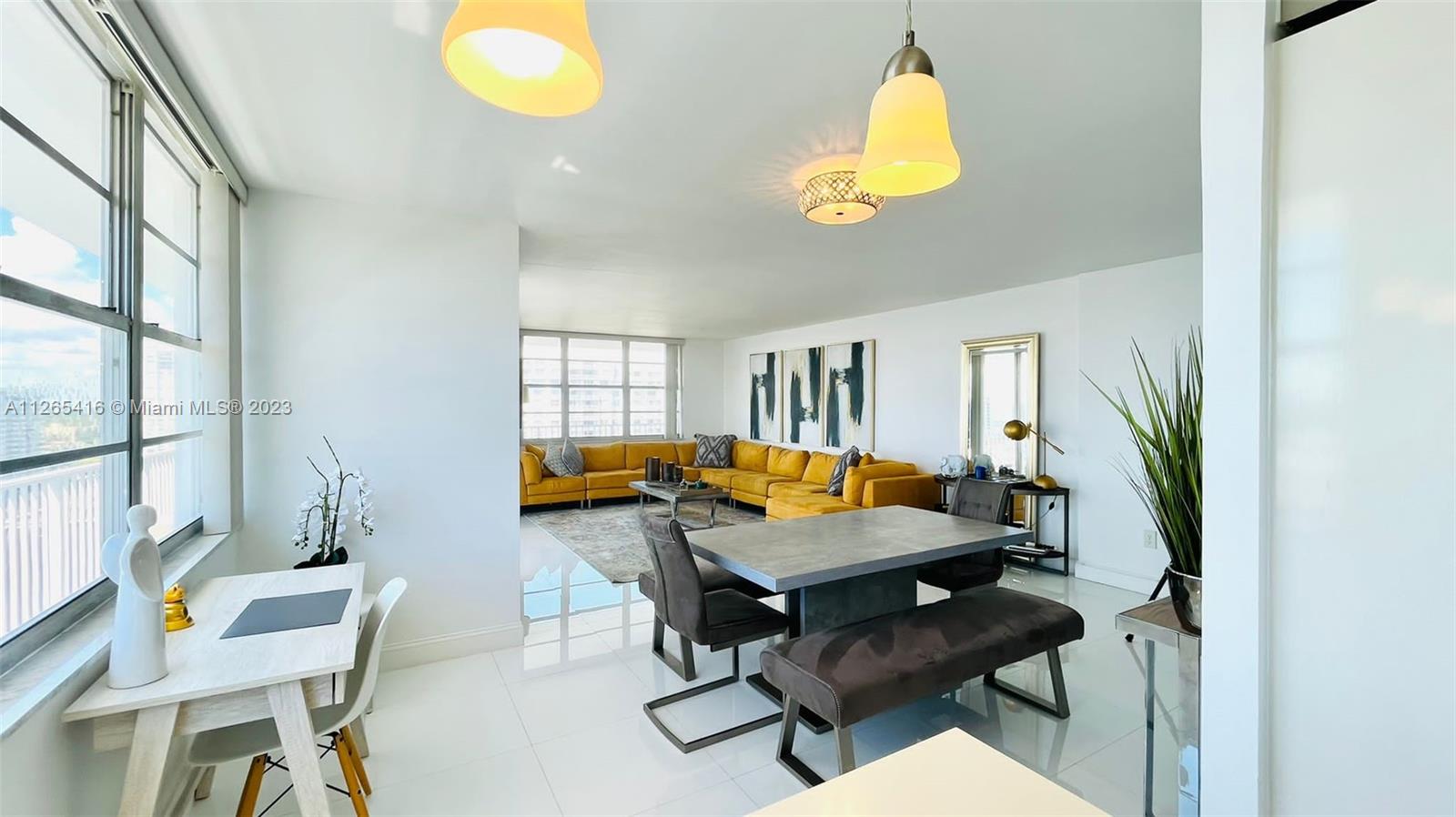 2851 Northeast 183rd Street, Unit 1816E Aventura, FL 33160 - Photo 5 of 29 a room with furniture and a window