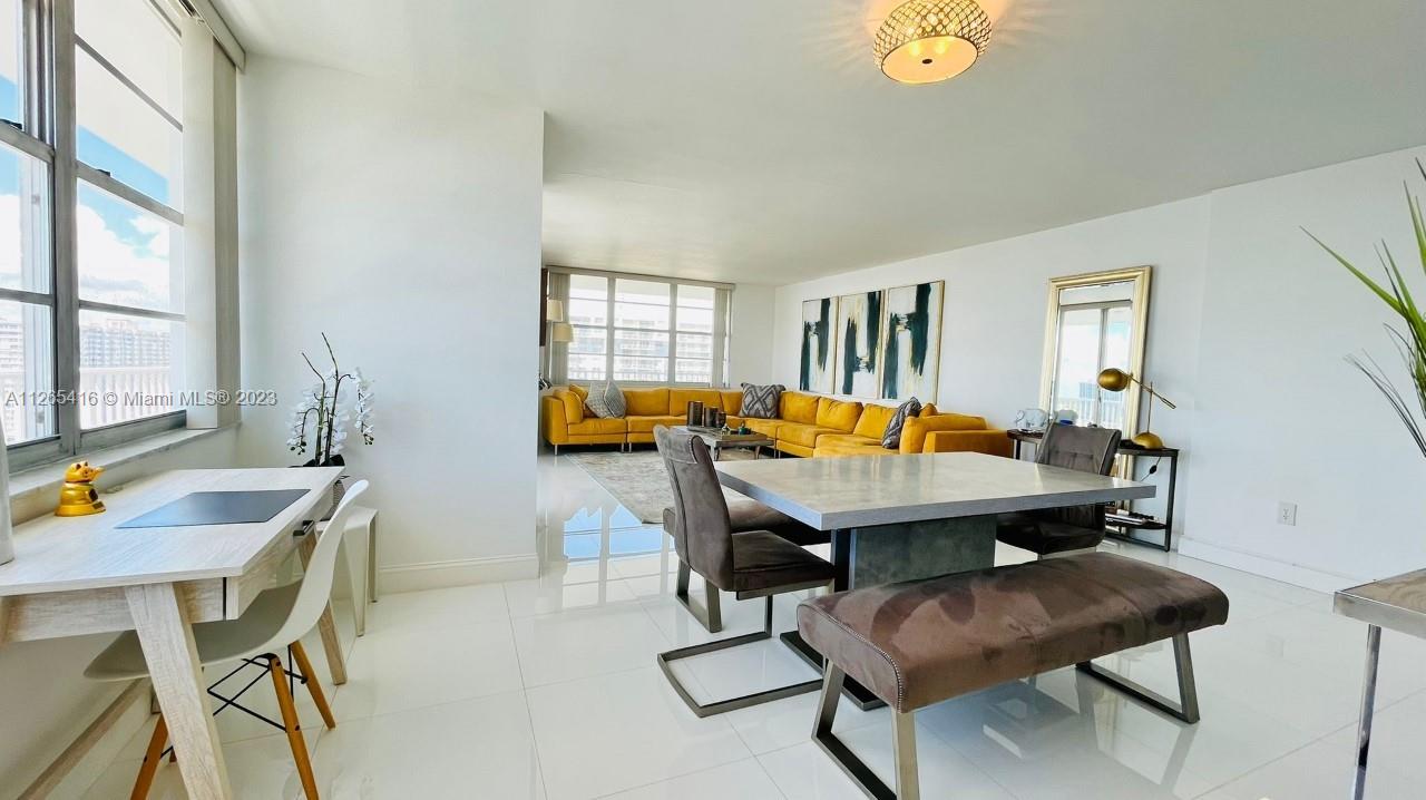 2851 Northeast 183rd Street, Unit 1816E Aventura, FL 33160 - Photo 6 of 29 a view of a dining room with furniture and a table
