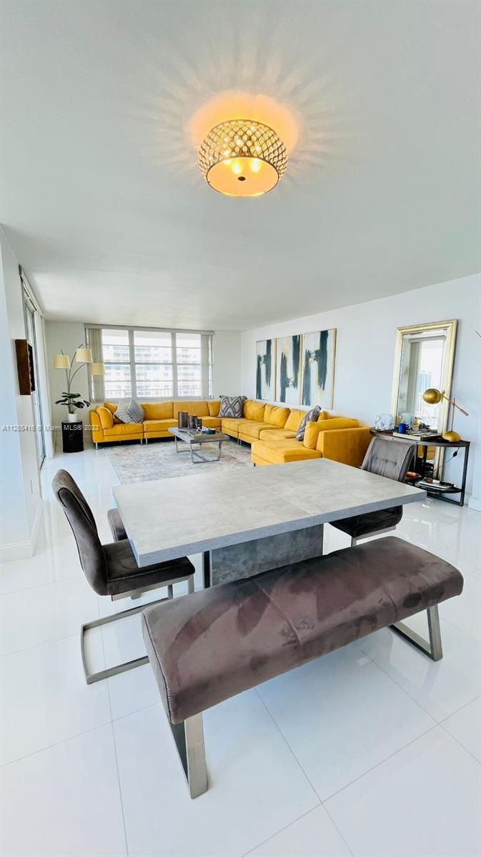 2851 Northeast 183rd Street, Unit 1816E Aventura, FL 33160 - Photo 7 of 29 a bedroom with furniture and window