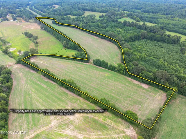 a view of a lake with a yard