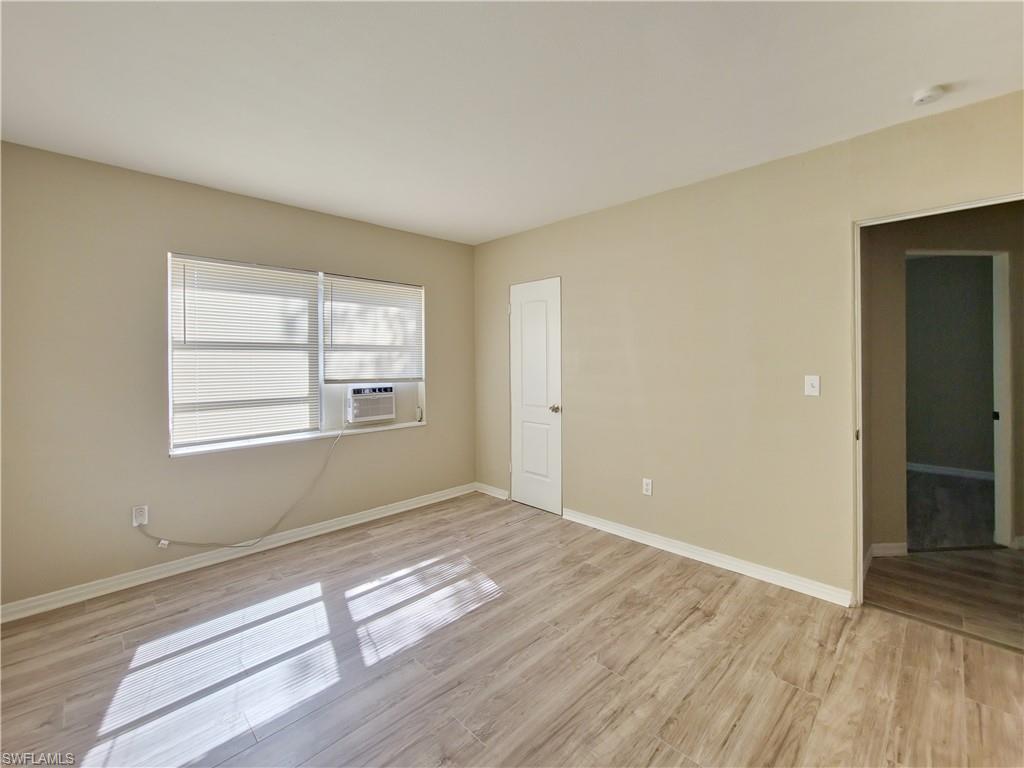 3488 Roberts Street Mims, FL 32754 - Photo 11 of 15 an empty room with wooden floor and windows