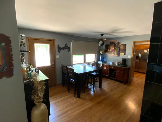 a room with furniture pool table and window