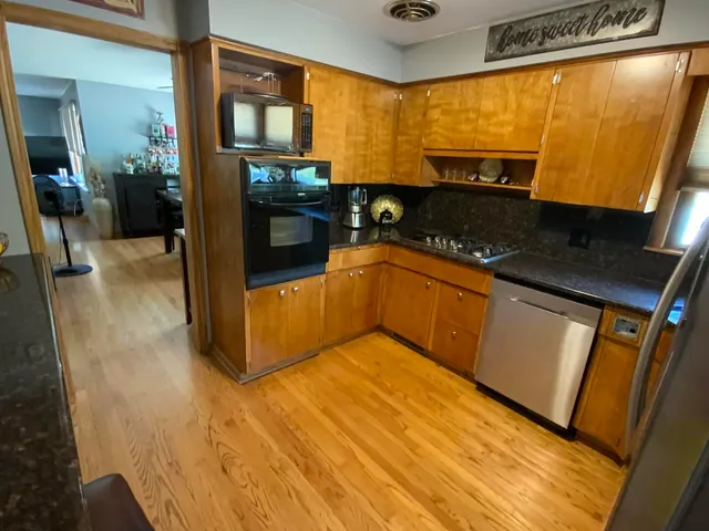 a living room with furniture gym equipment and a large window