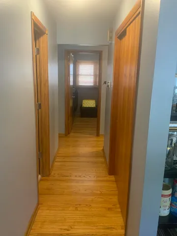 a view of a room with gym equipment and windows