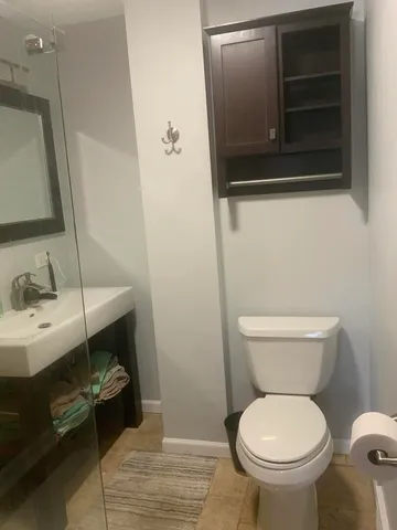 a view of a bathroom from a hallway
