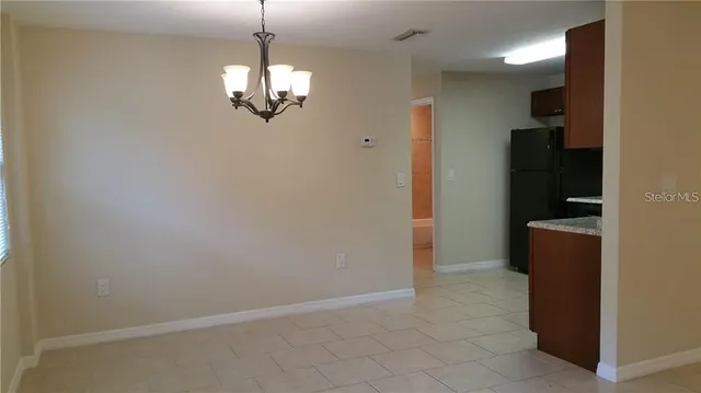 a view of a hallway with a chandelier
