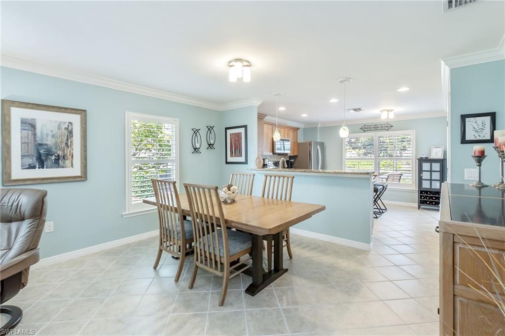 5801 Declaration Court Ave Maria, FL 34142 - Photo 10 of 38 a dining room with furniture and window