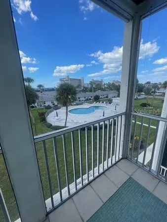 a view of a swimming pool with a patio