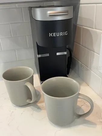 a white toilet sitting next to a sink
