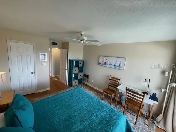 a living room with furniture and a piano