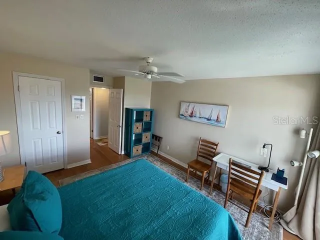 a living room with furniture and a piano