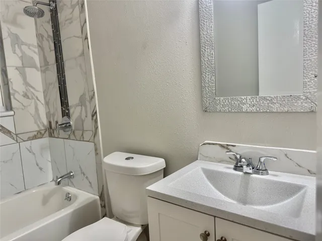 a bathroom with a sink and a toilet