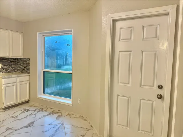 a view of an entryway with bathroom