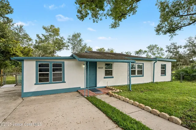 front view of a house with a yard