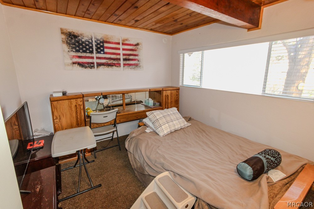 533 Victoria Lane Sugarloaf, CA 92386 - Photo 17 of 36 a bedroom with a bed and a window