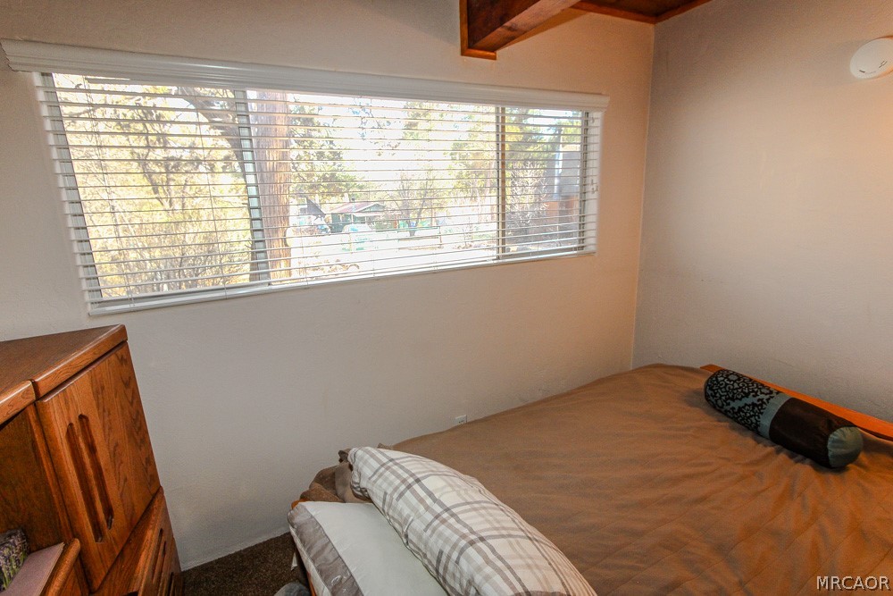 533 Victoria Lane Sugarloaf, CA 92386 - Photo 18 of 36 a bedroom with a bed and a window