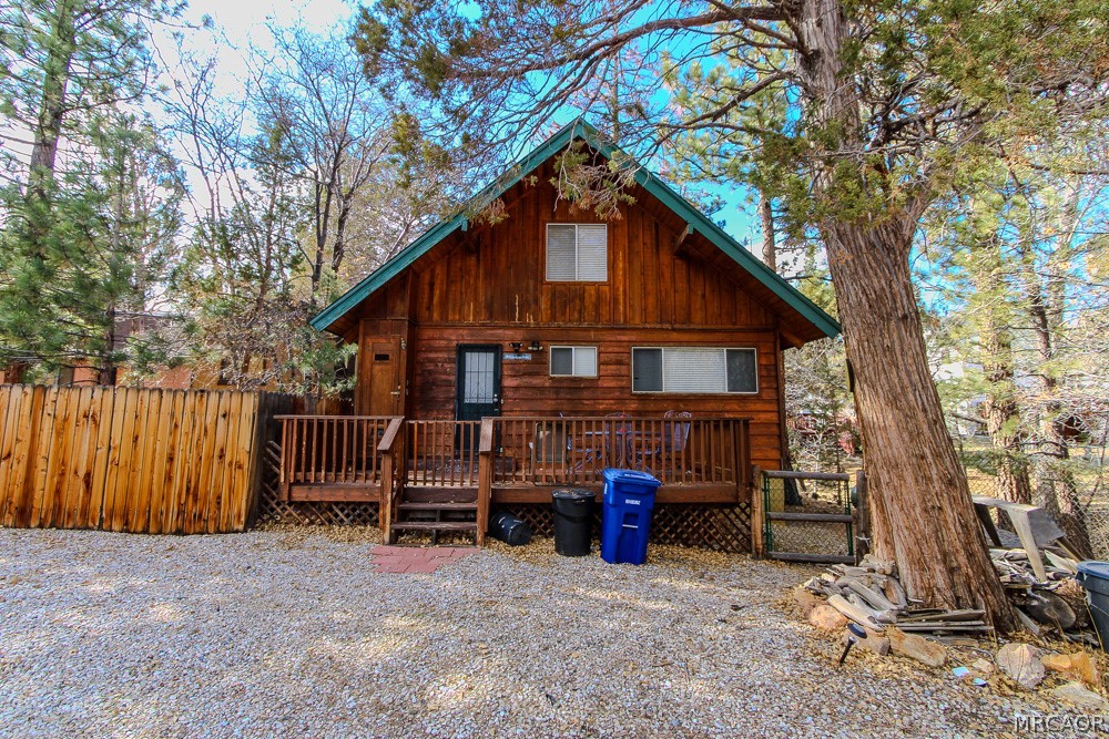 533 Victoria Lane Sugarloaf, CA 92386 - Photo 2 of 36 a view of a house with a yard and wooden fence