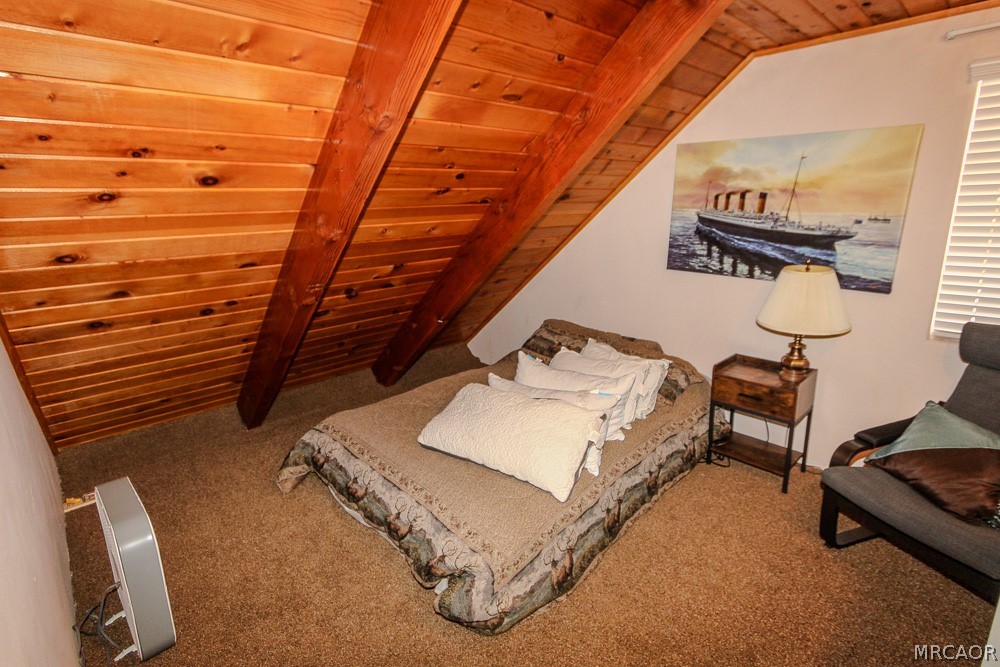 533 Victoria Lane Sugarloaf, CA 92386 - Photo 29 of 36 a bedroom with bed and a window