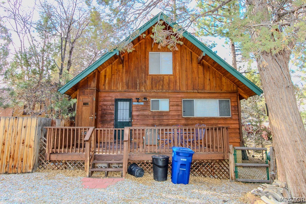 533 Victoria Lane Sugarloaf, CA 92386 - Photo 36 of 36 a backyard of a house with deck and outdoor seating