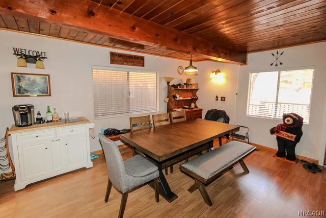 a living room with furniture a window and a table