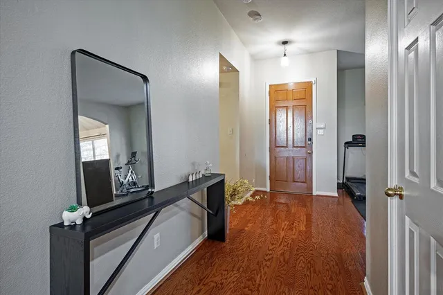 a spacious bathroom with a mirror and shower