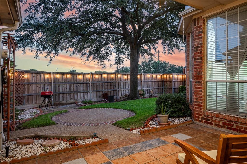 7906 Munich Drive Rowlett, TX 75088 - Photo 26 of 31 a view of a backyard with a garden