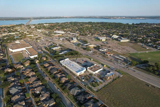 an aerial view of a city with ocean view
