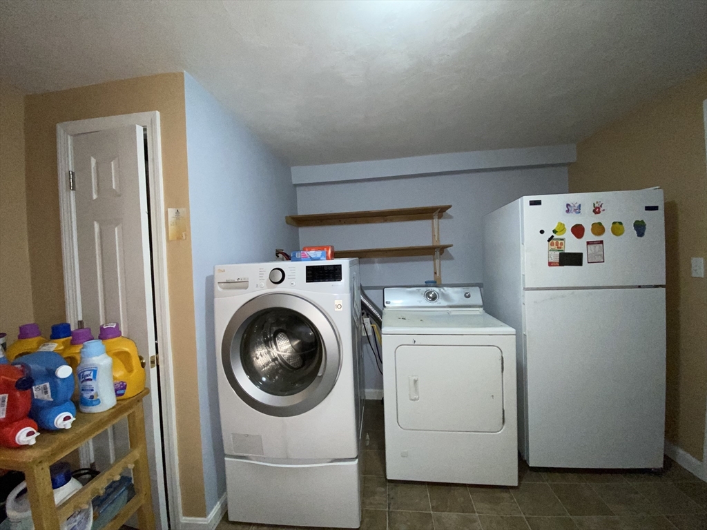 571 Ware Street Mansfield, MA 02048 - Photo 14 of 20 a utility room with dryer and washer