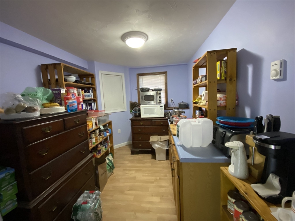 571 Ware Street Mansfield, MA 02048 - Photo 16 of 20 a living room with furniture a window and flat screen tv