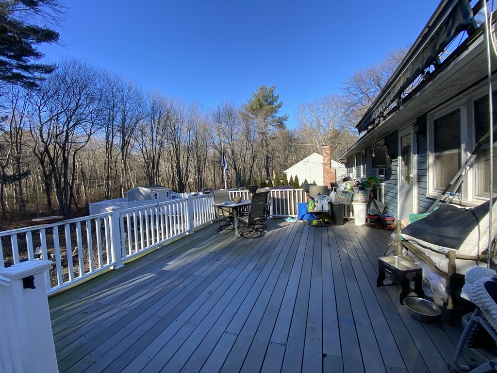 571 Ware Street Mansfield, MA 02048 - Photo 6 of 20 a view of a chairs and tables on the roof deck