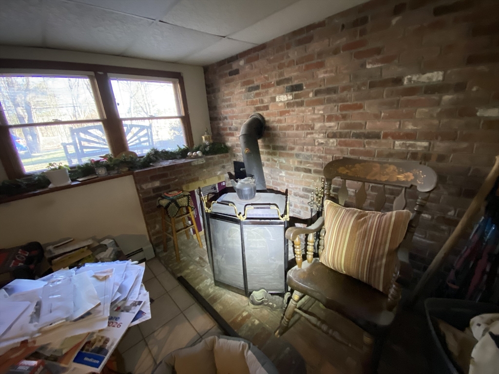 571 Ware Street Mansfield, MA 02048 - Photo 10 of 20 a living room with furniture and a window
