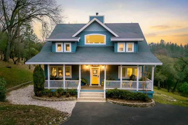 a large white kitchen with cabinets and wooden floor