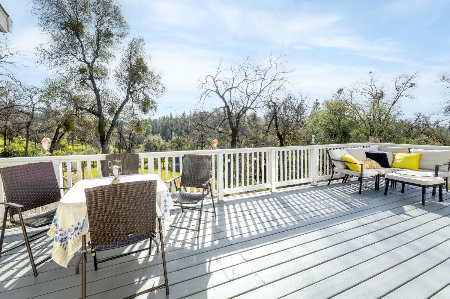 13579 Haas Court Rough and Ready, CA 95975 - Photo 21 of 79 a view of a chairs on deck with wooden floor and fence
