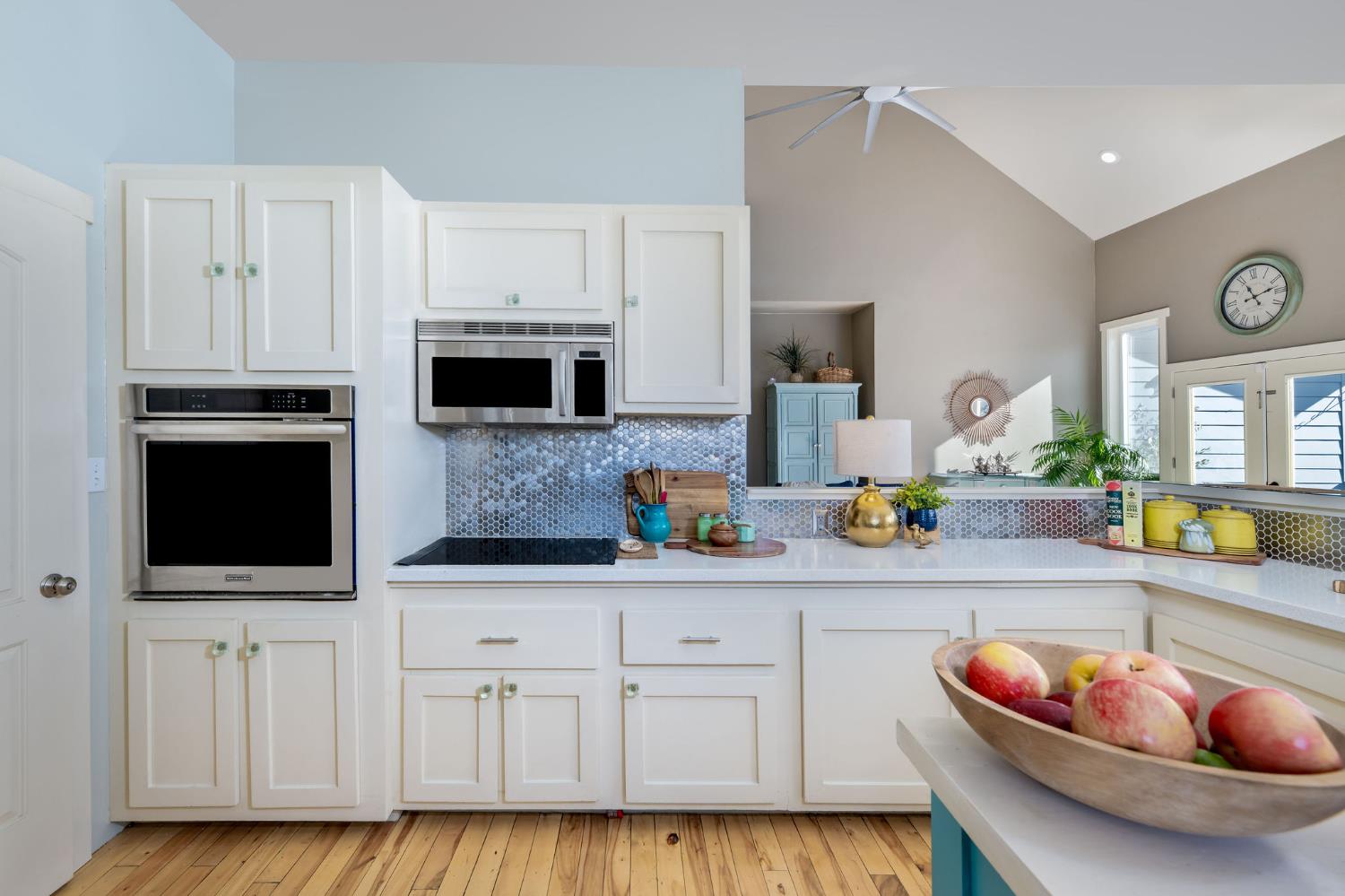 13579 Haas Court Rough and Ready, CA 95975 - Photo 30 of 79 a kitchen with stainless steel appliances granite countertop a sink a microwave a stove and white cabinets