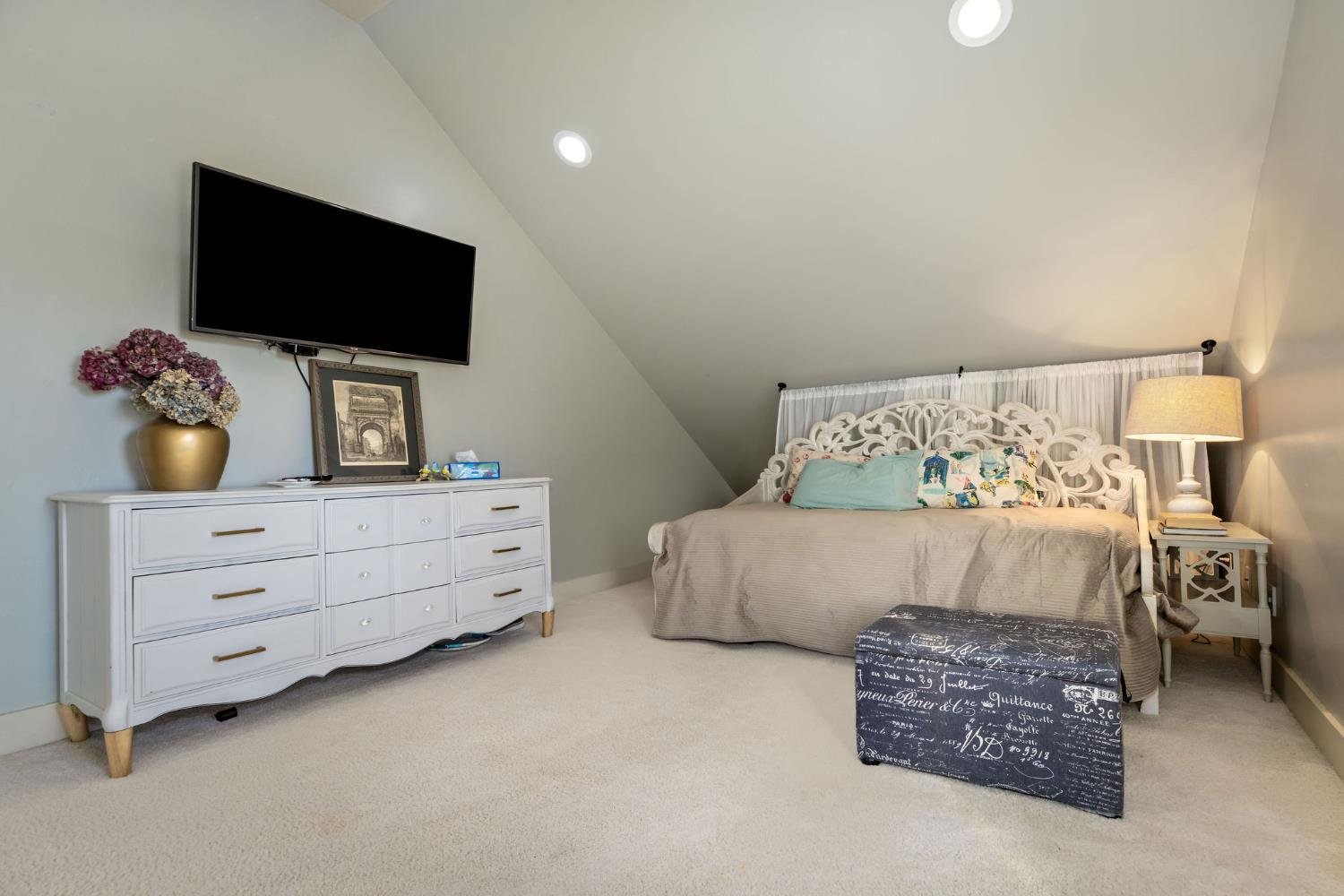 13579 Haas Court Rough and Ready, CA 95975 - Photo 9 of 79 a bedroom with furniture and flat screen tv