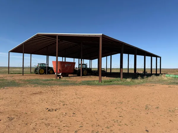 a view of a car park in front of a house