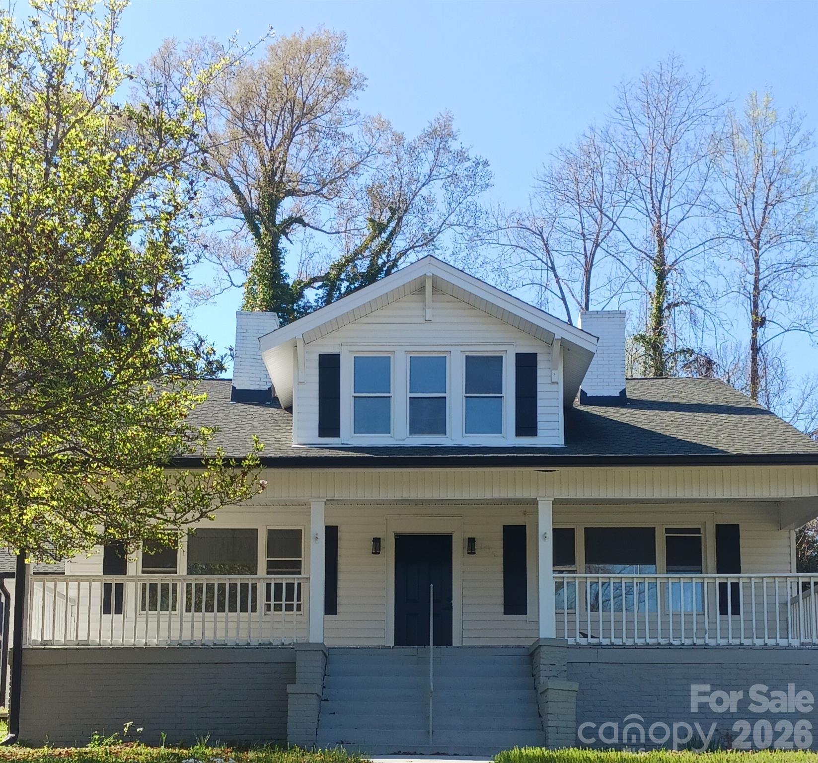 105 North Inman Avenue Bessemer City, NC 28016 - Photo 19 of 38 a front view of a house with windows