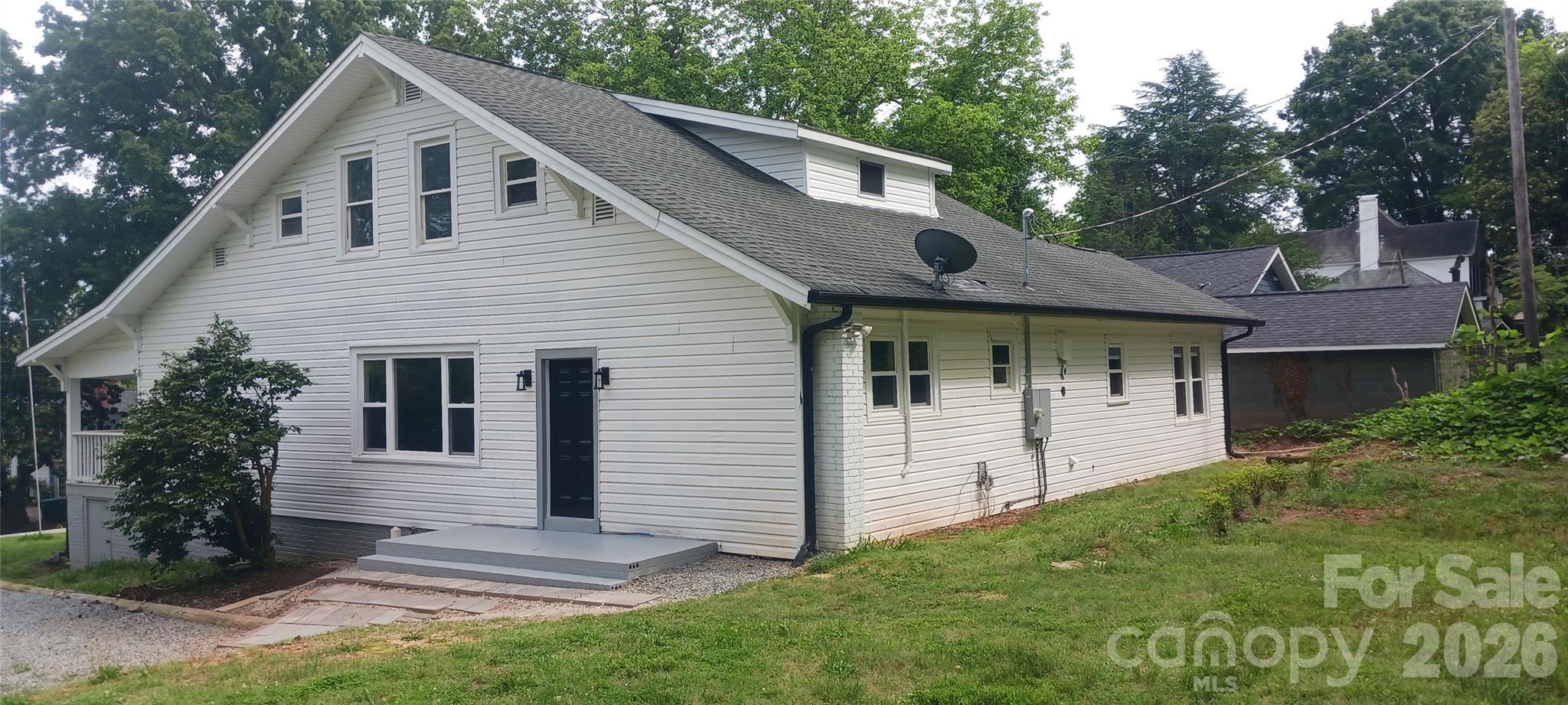105 North Inman Avenue Bessemer City, NC 28016 - Photo 22 of 38 a front view of a house with garden