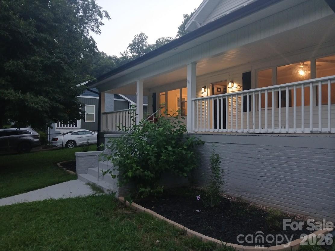 105 North Inman Avenue Bessemer City, NC 28016 - Photo 3 of 38 a backyard of a house with lots of green space