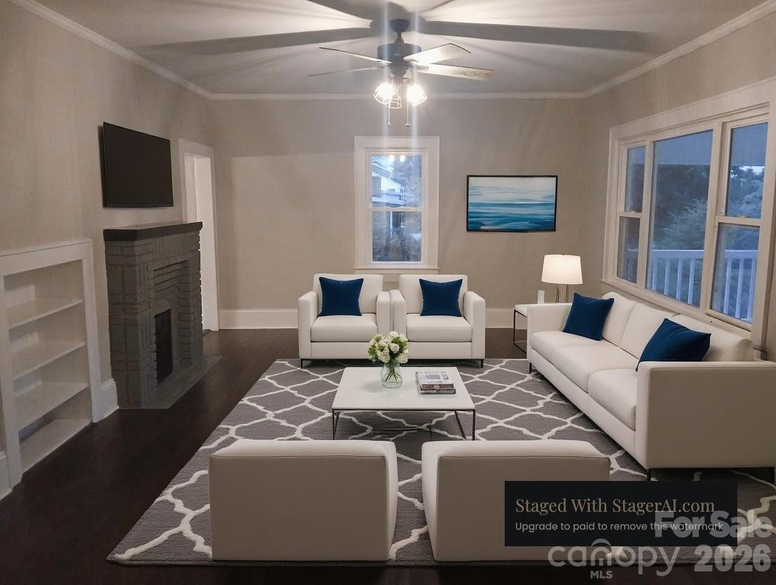 105 North Inman Avenue Bessemer City, NC 28016 - Photo 8 of 38 a living room with furniture a fireplace and a flat screen tv