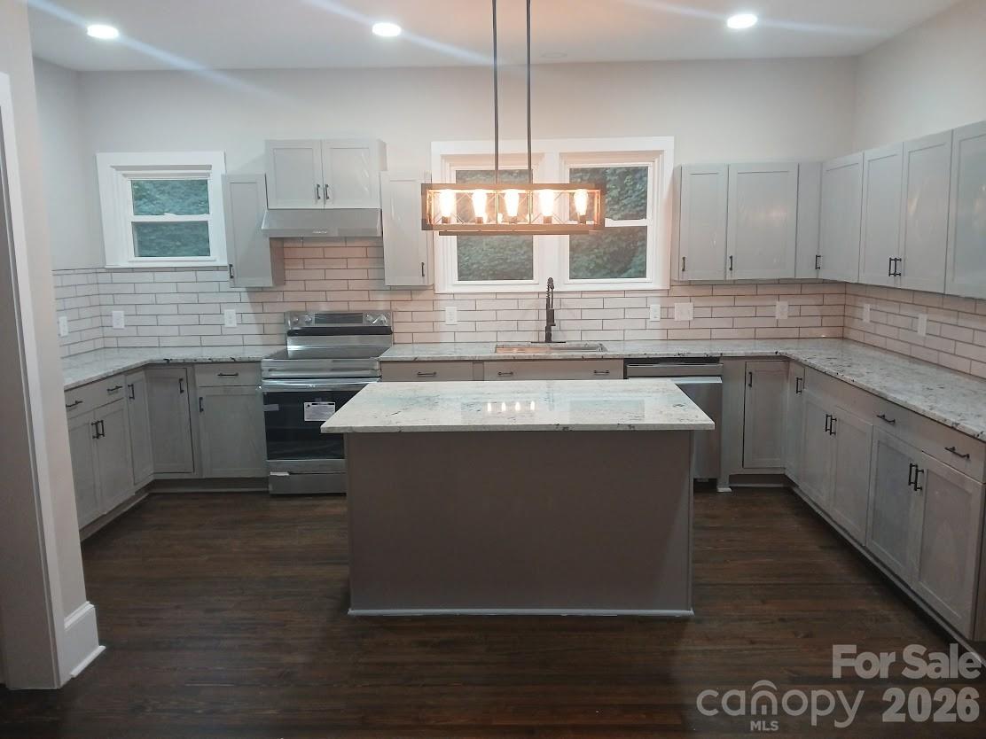 105 North Inman Avenue Bessemer City, NC 28016 - Photo 10 of 38 a kitchen with a sink stove and cabinets