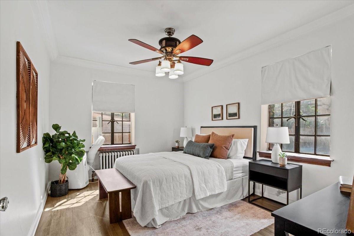 1575 Fillmore Street, Unit 6 Denver, CO 80206 - Photo 13 of 15 a bedroom with a bed and a potted plant