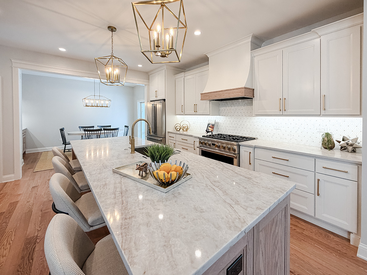 885 Geneva Road St. Charles, IL 60174 - Photo 8 of 39 a kitchen with a sink a stove and chairs