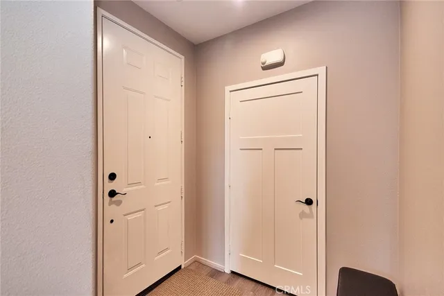 a view of a closet area with entryway