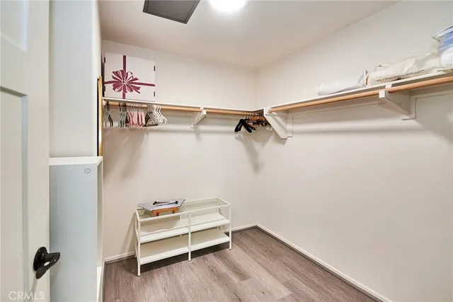 a view of storage and utility room with racks on the wall