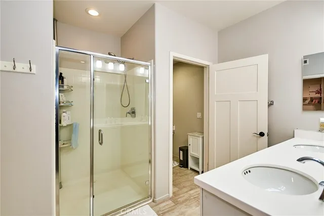 a bathroom with a shower and a sink