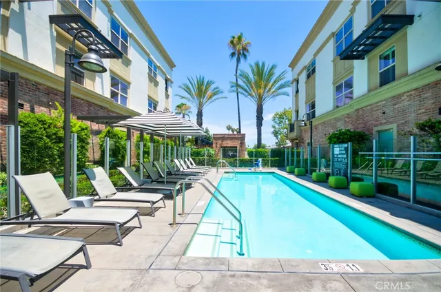 a view of a patio with swimming pool table and chairs