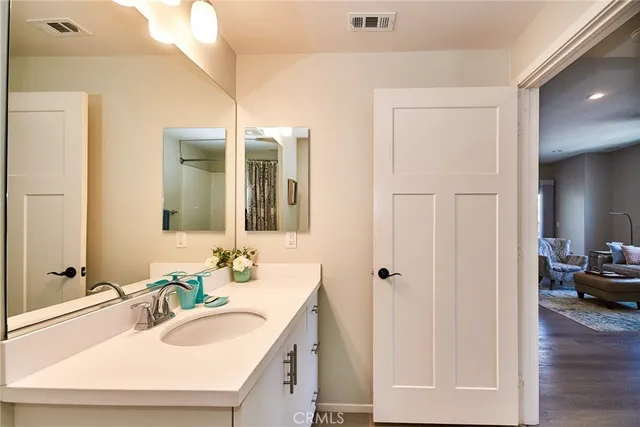a bathroom with a sink and a mirror