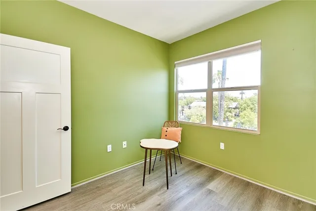 a room with a window and a chandelier