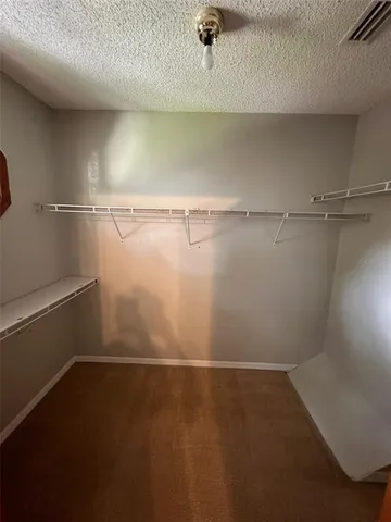 a view of a room with racks on the wall